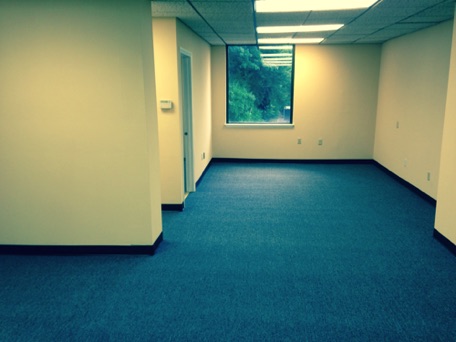 The office has new carpets, a large room and a private office The office has new carpets, a large room and a private office
